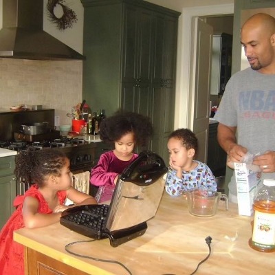 Childhood picture of Nicolas Neruda Kodjoe and his sisters alongside his father, Boris Kodjoe.